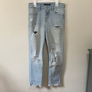 Faded and distressed mom style jeans